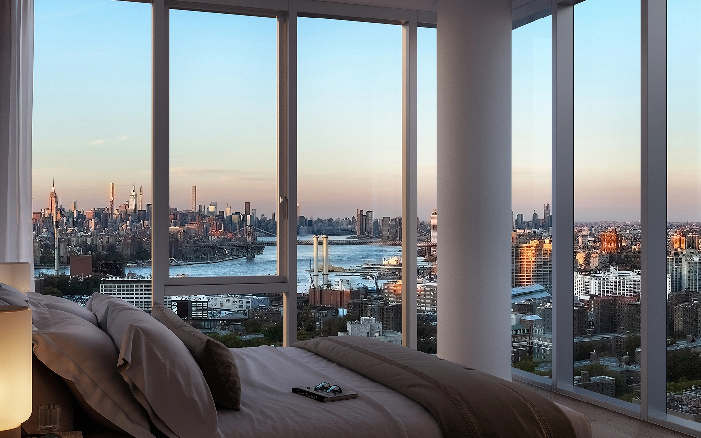 Bedroom interior with floor-to-ceiling windows and river view in at 89 DeKalb luxury rental residences in Fort Greene.