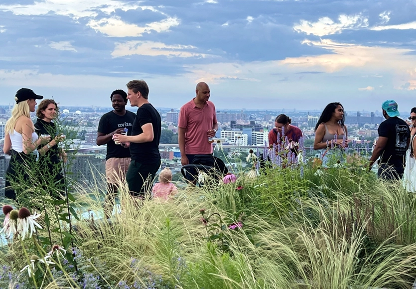 Residents chatting on the outdoor rooftop terrace at 89 DeKalb luxury apartment for rent in Fort Greene, Brooklyn.